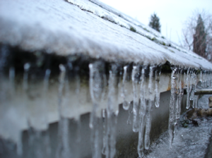 Frozen gutters in Toronto home that is melting