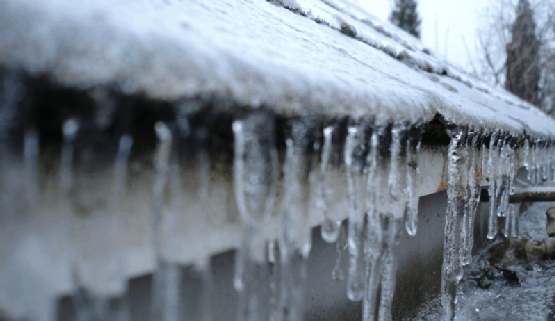 Frozen gutters in Toronto home that is melting