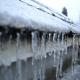 Frozen gutters in Toronto home that is melting