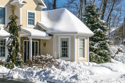 House with melting snow on roof in Toronto